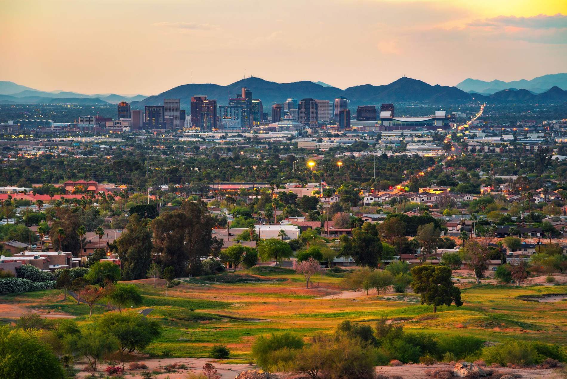 Phoenix skyline and the Valley at sunset with Camelback Mountain in the distance